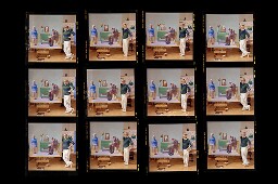 Low resolution digital scan of a contact sheet from Bern Schwartz's portrait 678: David Hockney (standing)
